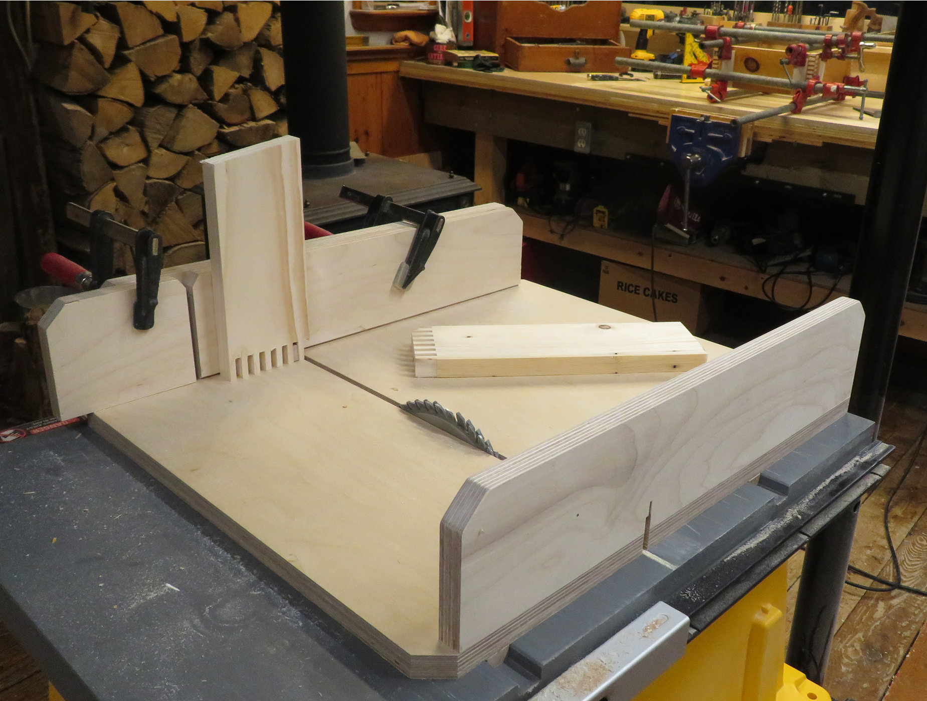 Mock-up of a box joint jig on a table saw sled